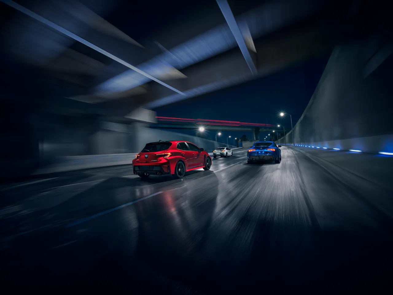 GR86 coupés in a lit tunnel