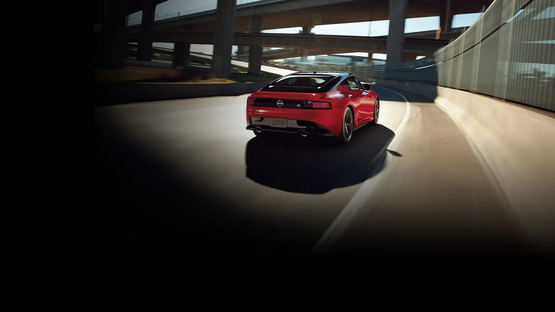 Nissan Z in red driving through a tunnel